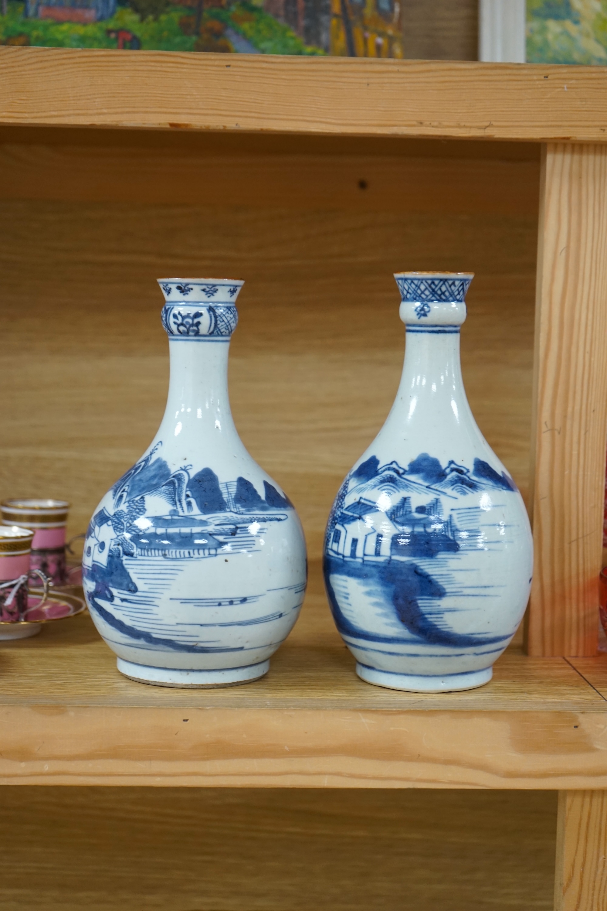 Two Chinese blue and white guglet bottles, 18th century, tallest 24cm high. Condition - good